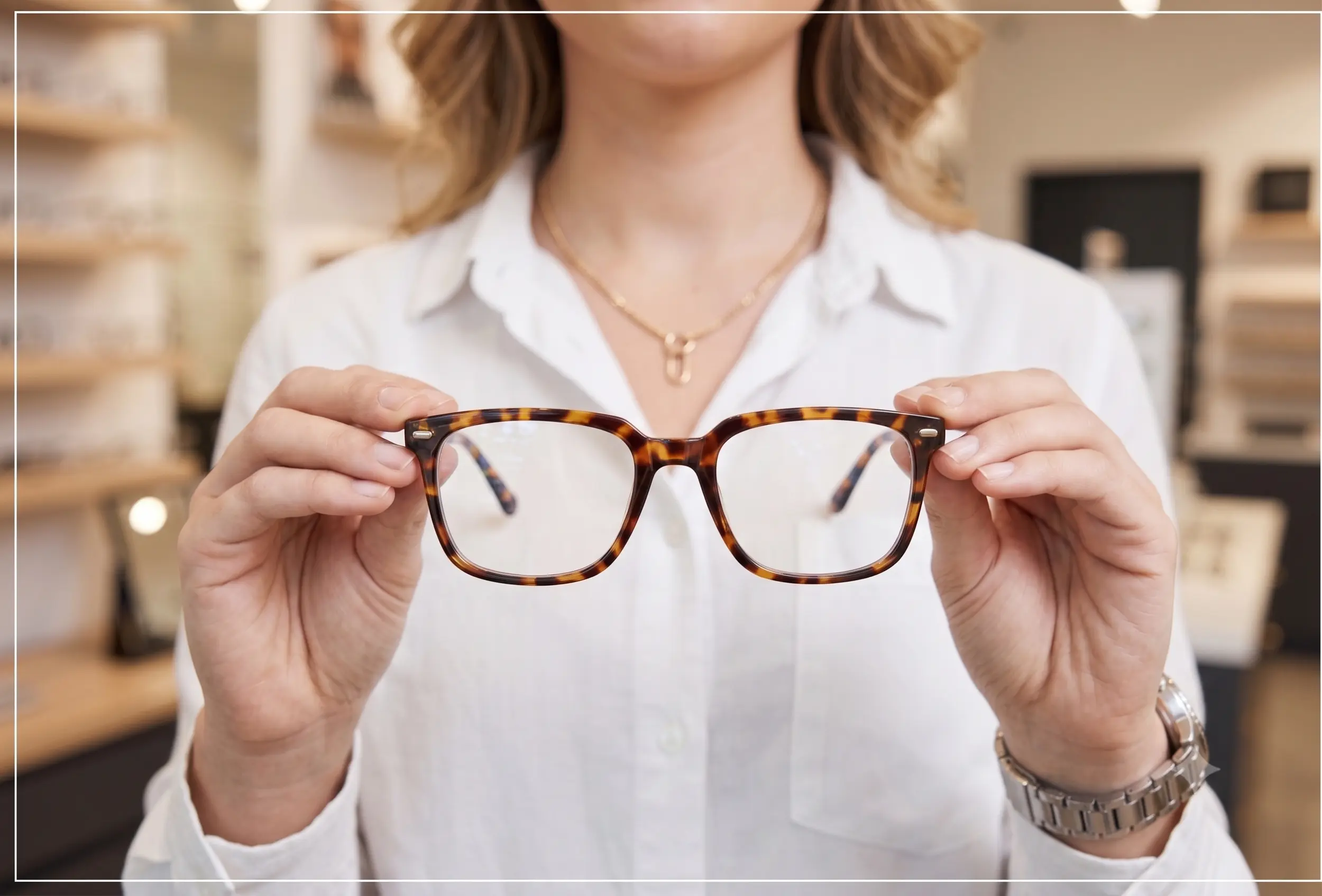 Woman holding glasses